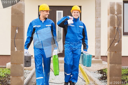 Image of group of builders with toolboxes