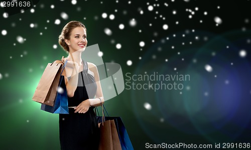 Image of smiling woman with shopping bags
