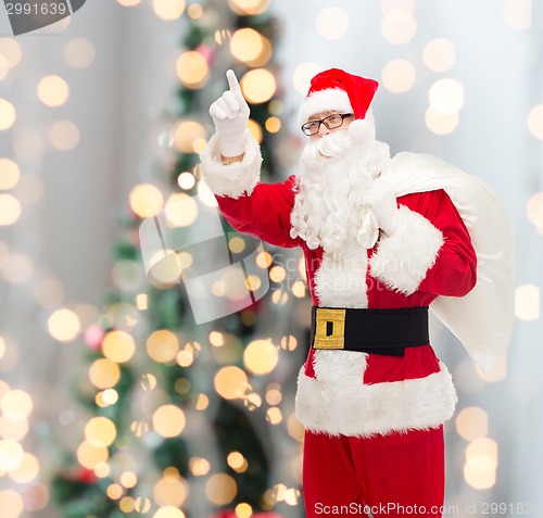 Image of man in costume of santa claus with bag