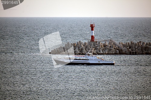 Image of A ship and the lighthouse