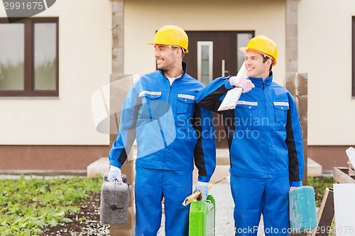 Image of group of builders with toolboxes