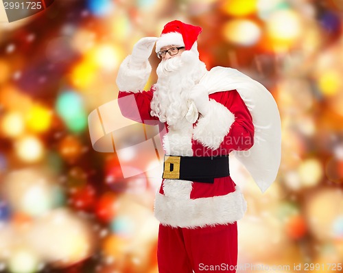 Image of man in costume of santa claus with bag