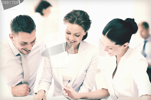 Image of business team having discussion in office