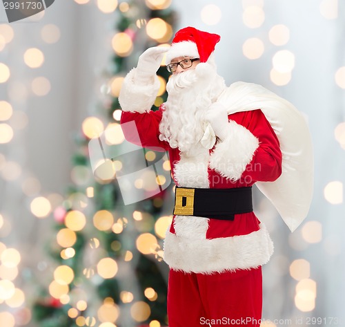 Image of man in costume of santa claus with bag