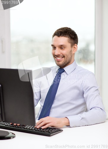 Image of smiling businessman or student with computer