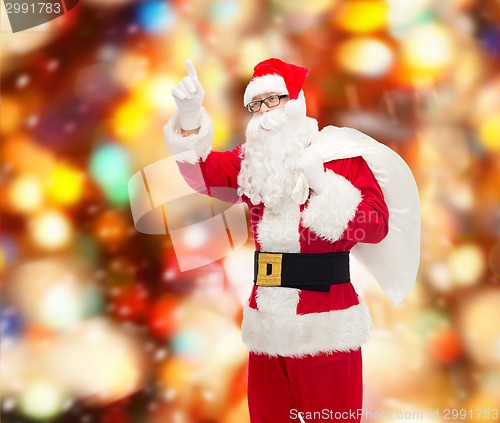 Image of man in costume of santa claus with bag