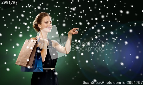 Image of smiling woman with shopping bags