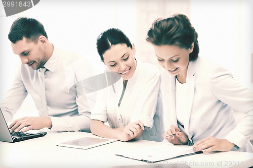 Image of business team working in office