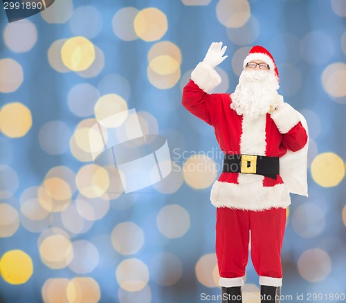 Image of man in costume of santa claus with bag