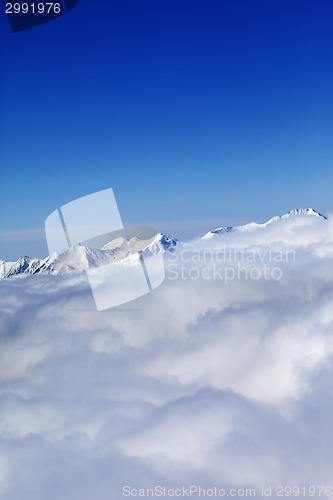 Image of Mountains in clouds at nice sun day