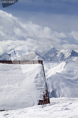 Image of Roof of hotel in snow and ski slope