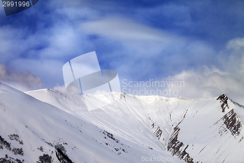 Image of Snowy mountains in sun morning