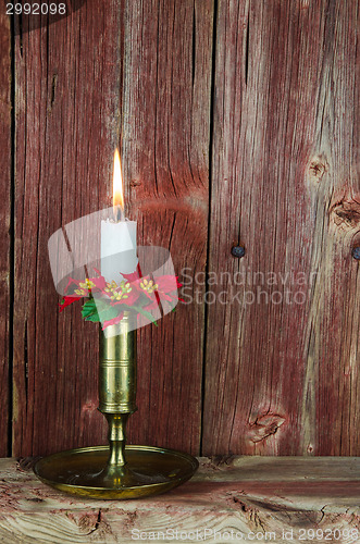 Image of A burning christmas decorated candle 