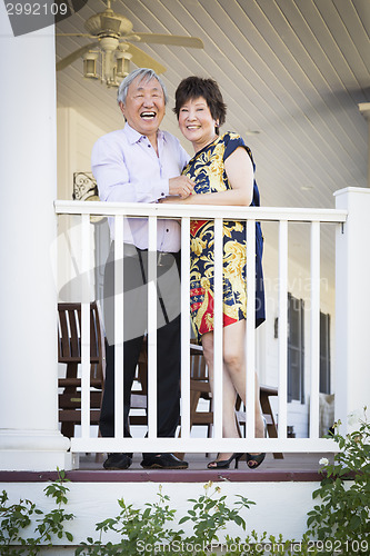 Image of Attractive Chinese Couple Enjoying Their House