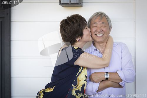 Image of Attractive Chinese Couple Enjoying Their House