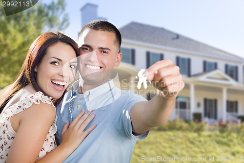 Image of Military Couple with House Keys In Front of New Home