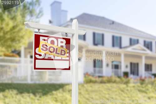Image of Sold Home For Sale Sign in Front of New House
