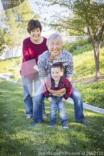 Image of Chinese Grandparents Having Fun with Their Mixed Race Grandson O