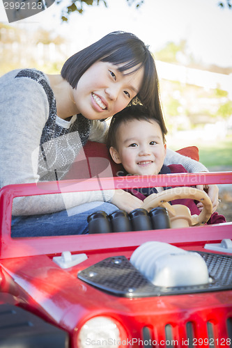 Image of Chinese Mother Having Fun with Her Mixed Race Baby Son