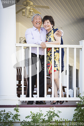 Image of Attractive Chinese Couple Enjoying Their House