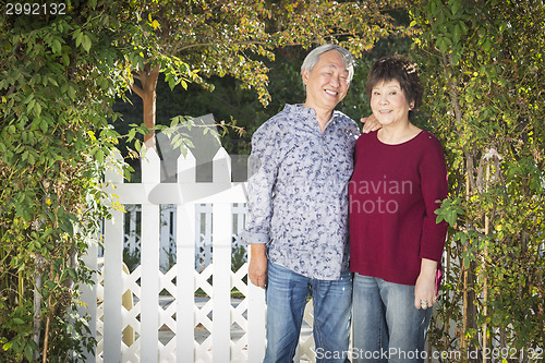 Image of Attractive Chinese Couple Enjoying Their House
