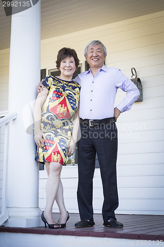 Image of Attractive Chinese Couple Enjoying Their House