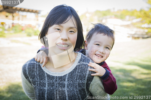 Image of Chinese Mother Having Fun with Her Mixed Race Baby Son