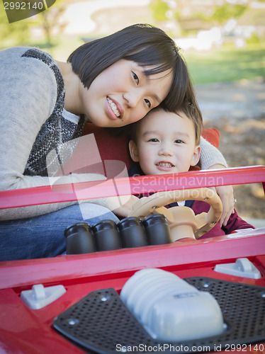 Image of Chinese Mother Having Fun with Her Mixed Race Baby Son