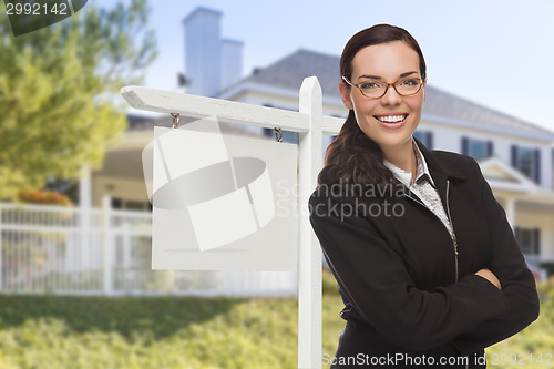 Image of Woman In Front of House and Blank Real Estate Sign