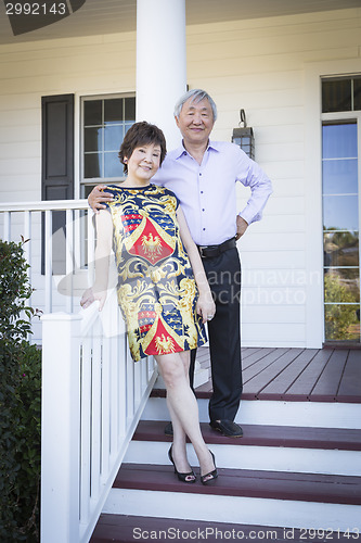 Image of Attractive Chinese Couple Enjoying Their House