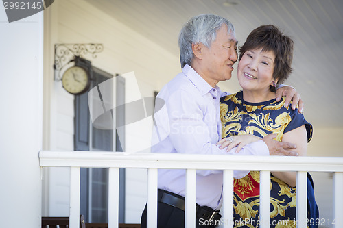 Image of Attractive Chinese Couple Enjoying Their House