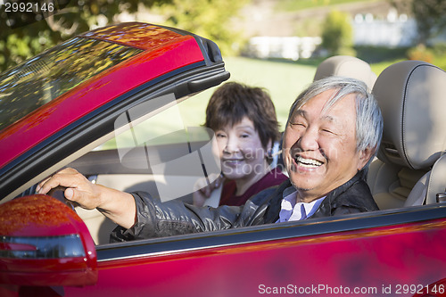 Image of Happy Chinese Couple Enjoying An Afternoon Drive in Their Conver