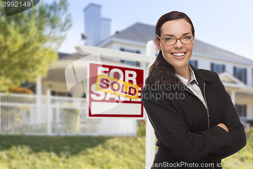 Image of Mixed Race Woman in Front of House and Sold Sign