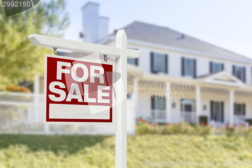 Image of Home For Sale Sign in Front of New House