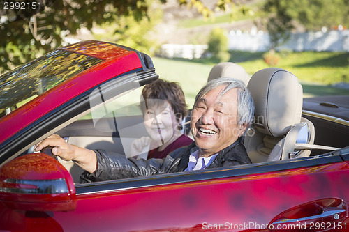 Image of Happy Chinese Couple Enjoying An Afternoon Drive in Their Conver