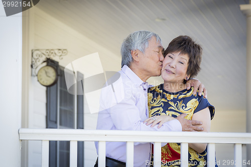 Image of Attractive Chinese Couple Enjoying Their House