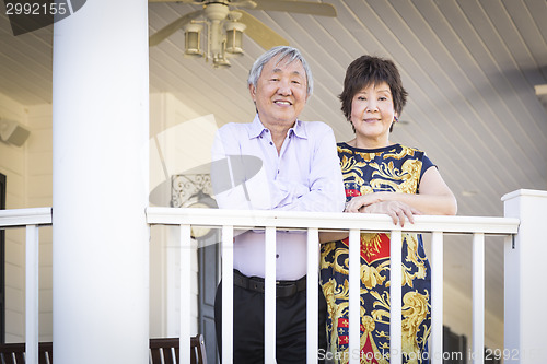 Image of Attractive Chinese Couple Enjoying Their House