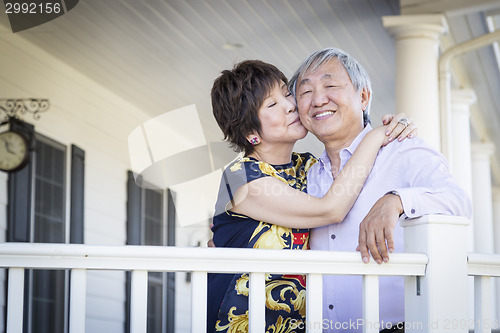 Image of Attractive Chinese Couple Enjoying Their House