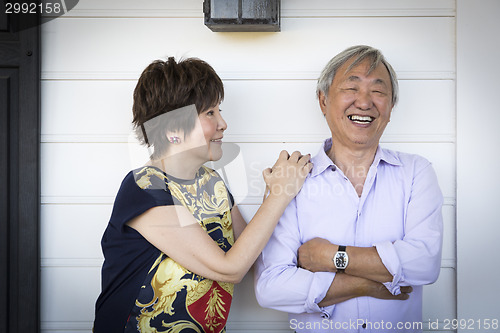 Image of Attractive Chinese Couple Enjoying Their House