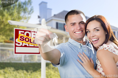 Image of Military Couple In Front of Home, House Keys and Sign