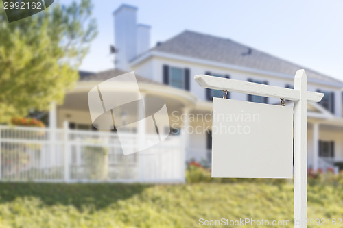 Image of Blank Real Estate Sign in Front of New House 