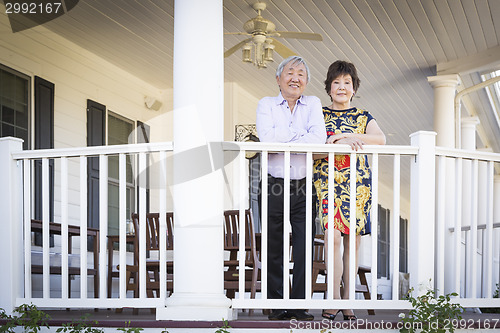 Image of Attractive Chinese Couple Enjoying Their House