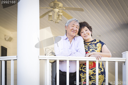 Image of Attractive Chinese Couple Enjoying Their House