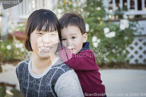 Image of Chinese Mother Having Fun with Her Mixed Race Baby Son