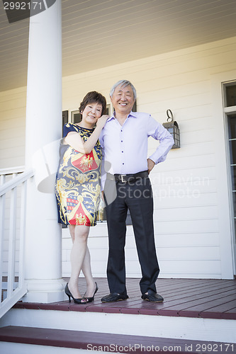 Image of Attractive Chinese Couple Enjoying Their House