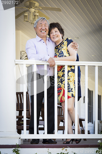 Image of Attractive Chinese Couple Enjoying Their House