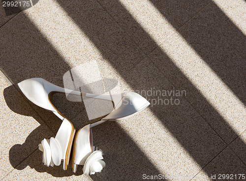 Image of white wedding shoes. Close up