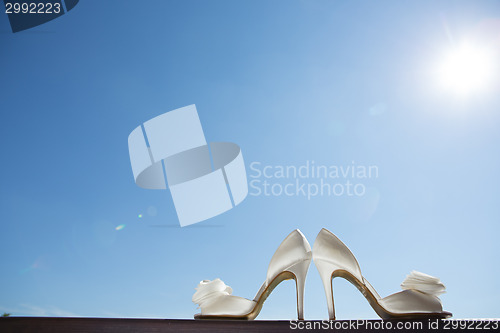 Image of white wedding shoes. Close up