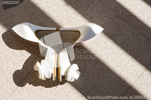 Image of white wedding shoes. Close up