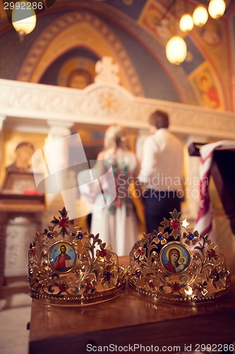 Image of Married couple kissing in a church